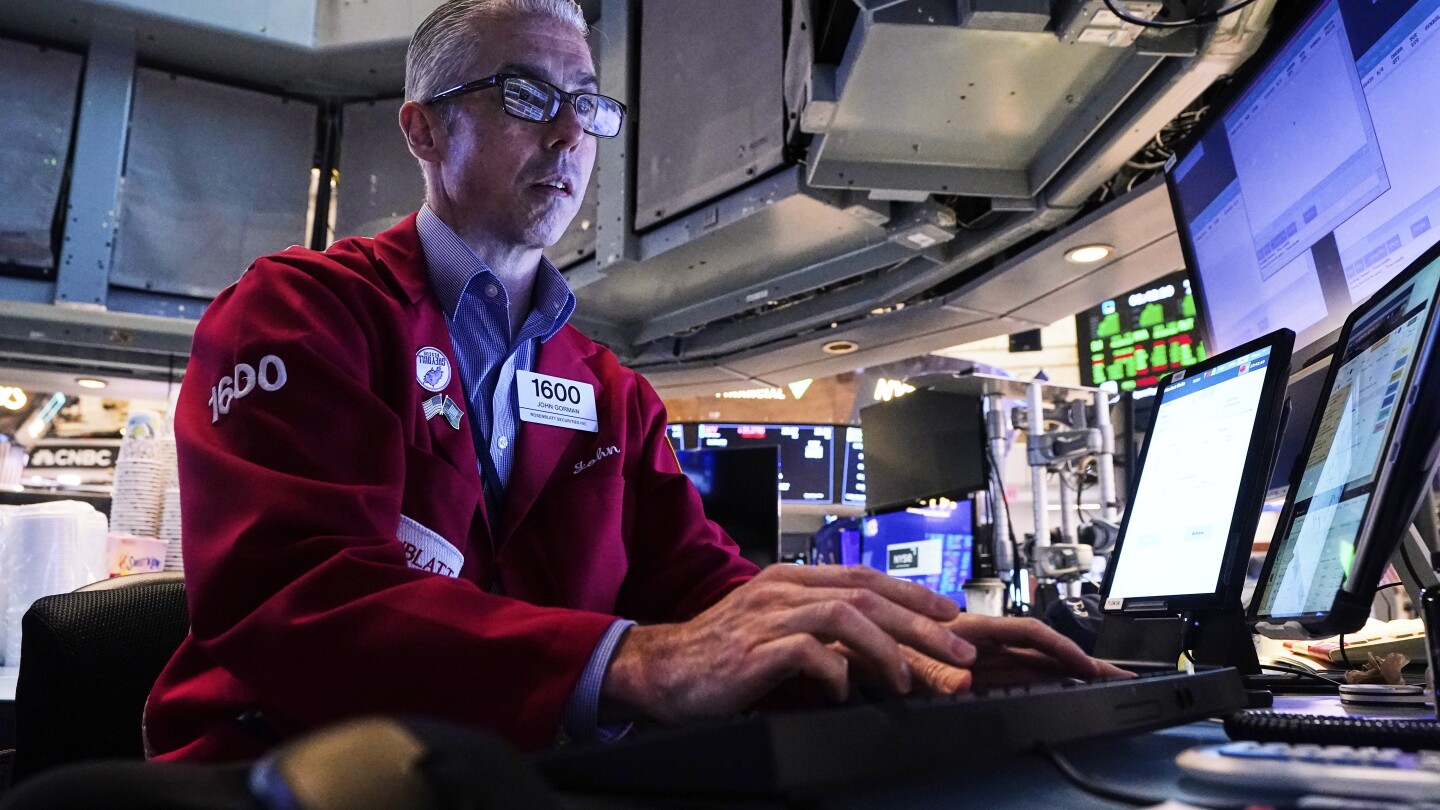 A rally for Alphabet helps offset Tesla’s tumble and nudges Wall Street to more records