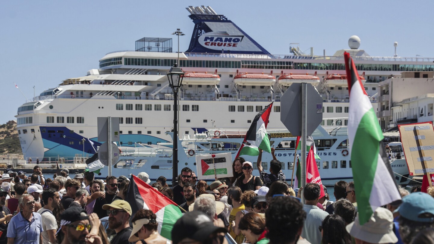 Anti-war demonstrators protest the arrival of an Israeli cruise ship on the Greek island of Crete