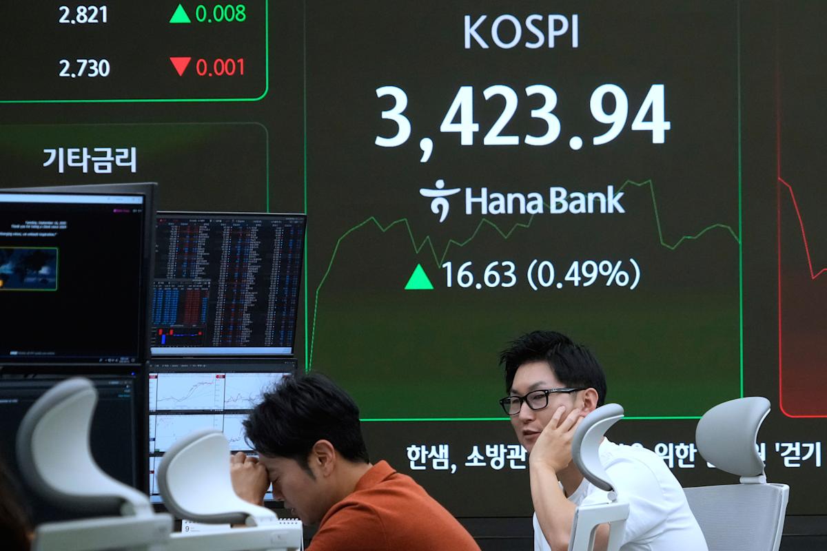 Asian benchmarks are mixed after Wall Street edges down from record highs