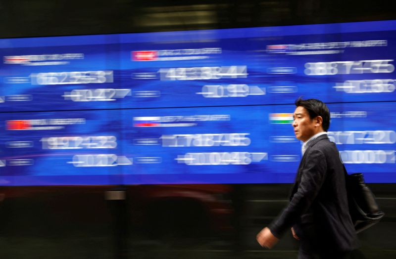 Stocks hesitate in Asia with a lot riding on the Fed