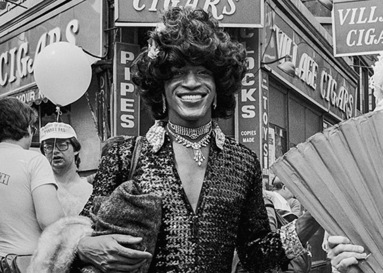 Marsha P. Johnson Marsha P. Johnson smiles for a photographer during the 1982 Pride March in New York City.