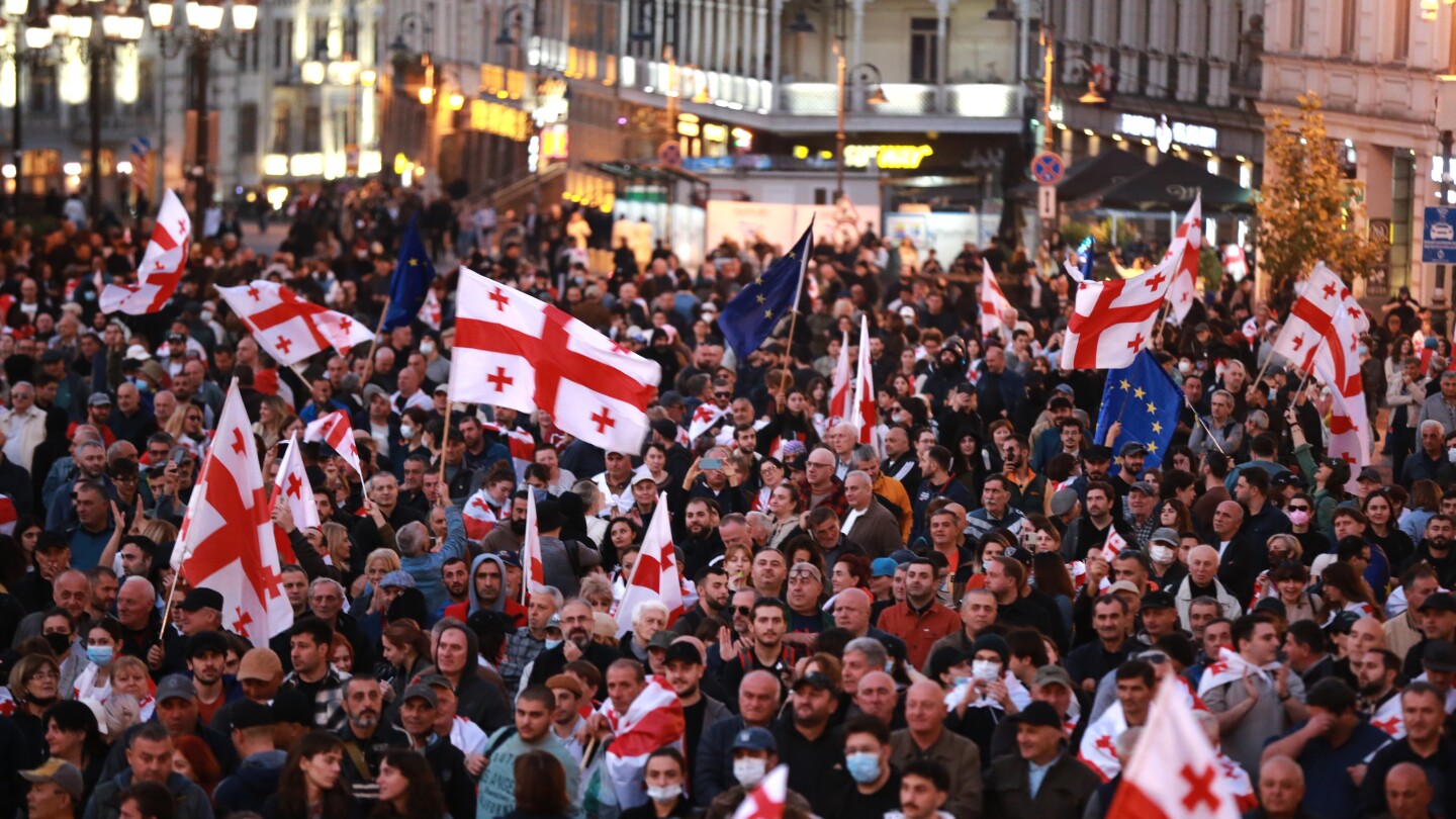 Tens of thousands march against Georgia’s government as local election snubbed by opposition held