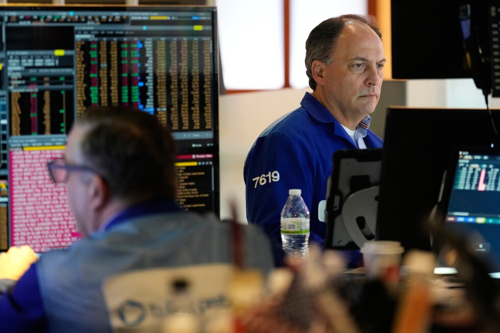 Asia shares lower after Wall Street losses on AI worries